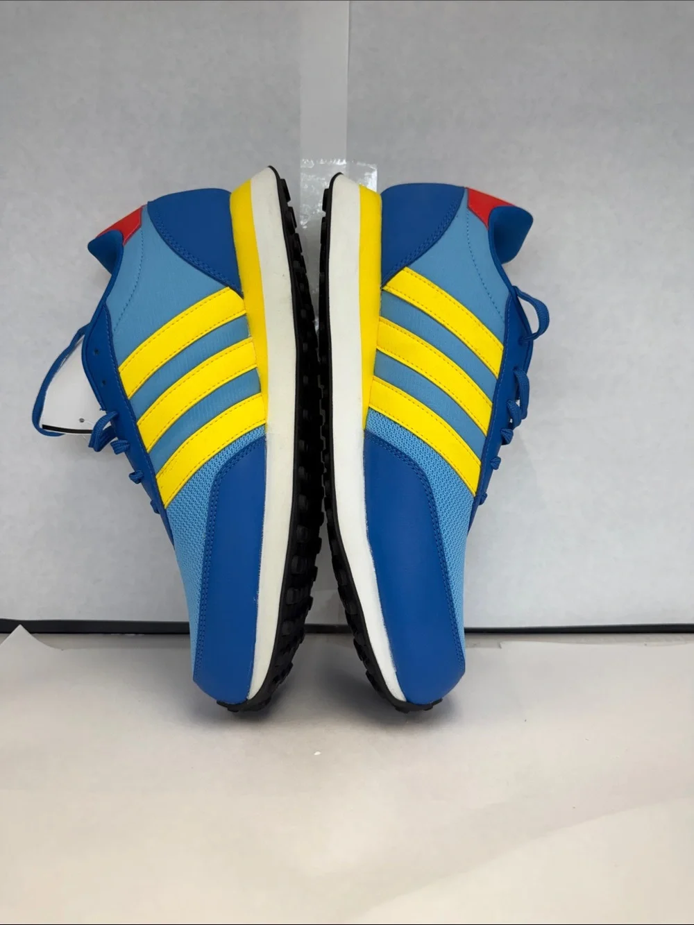 adidas Men's Blue Sneakers with Yellow Stripes and Red Heel Accent